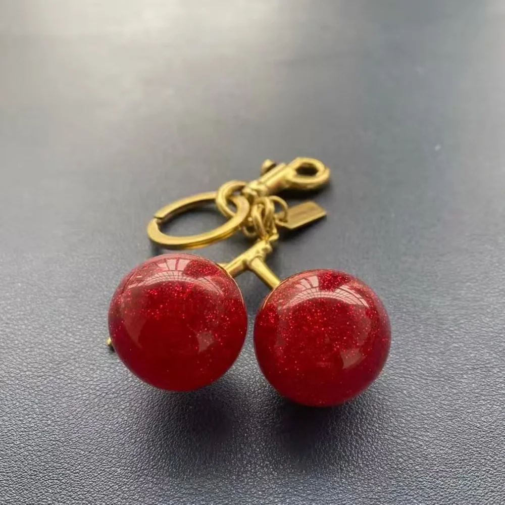 Coach Gold-Tone Keychain with Red Glitter Cherry Charms
